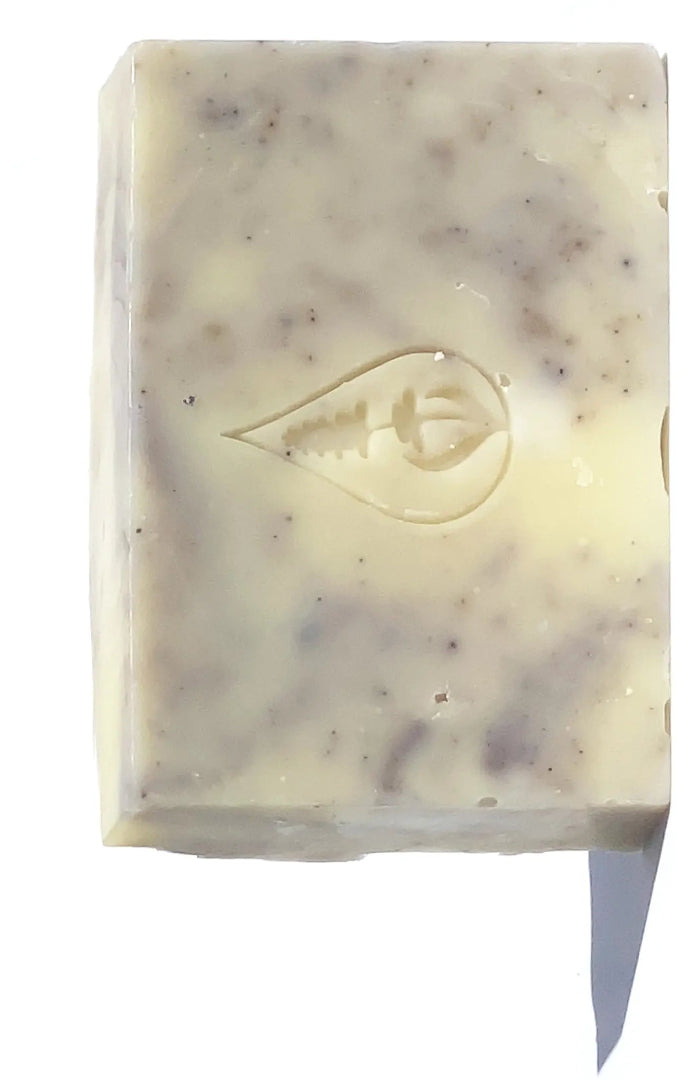 By Valenti Lavender & Almond Bar Soap in light lavender and white colors with By Valenti logo stamped on the soap on a white background