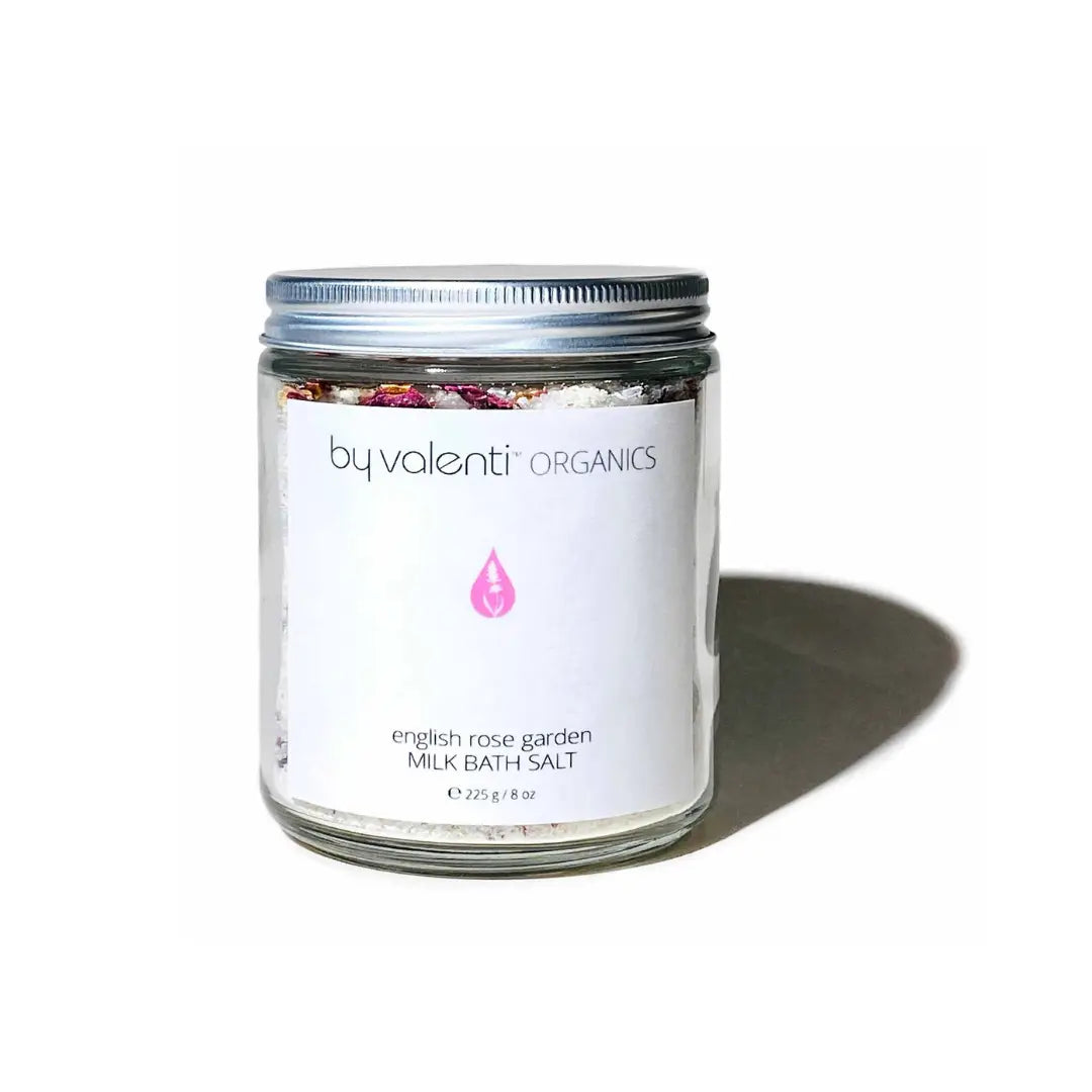 By Valenti jar of English rose garden goat milk bath salt on a white background