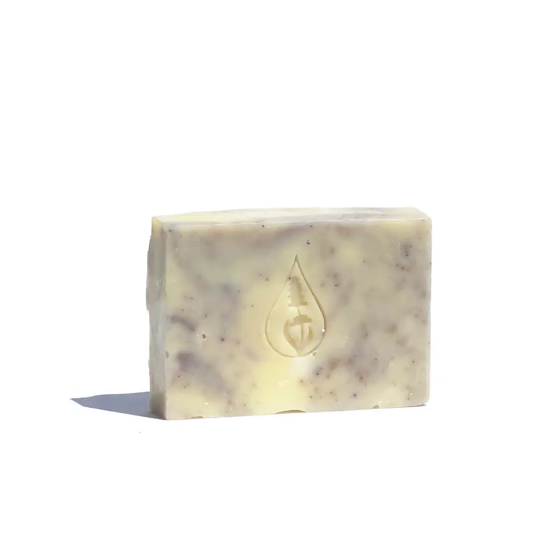 By Valenti light violet Lavender & Almond bar soap with stamped brand logo on a white background