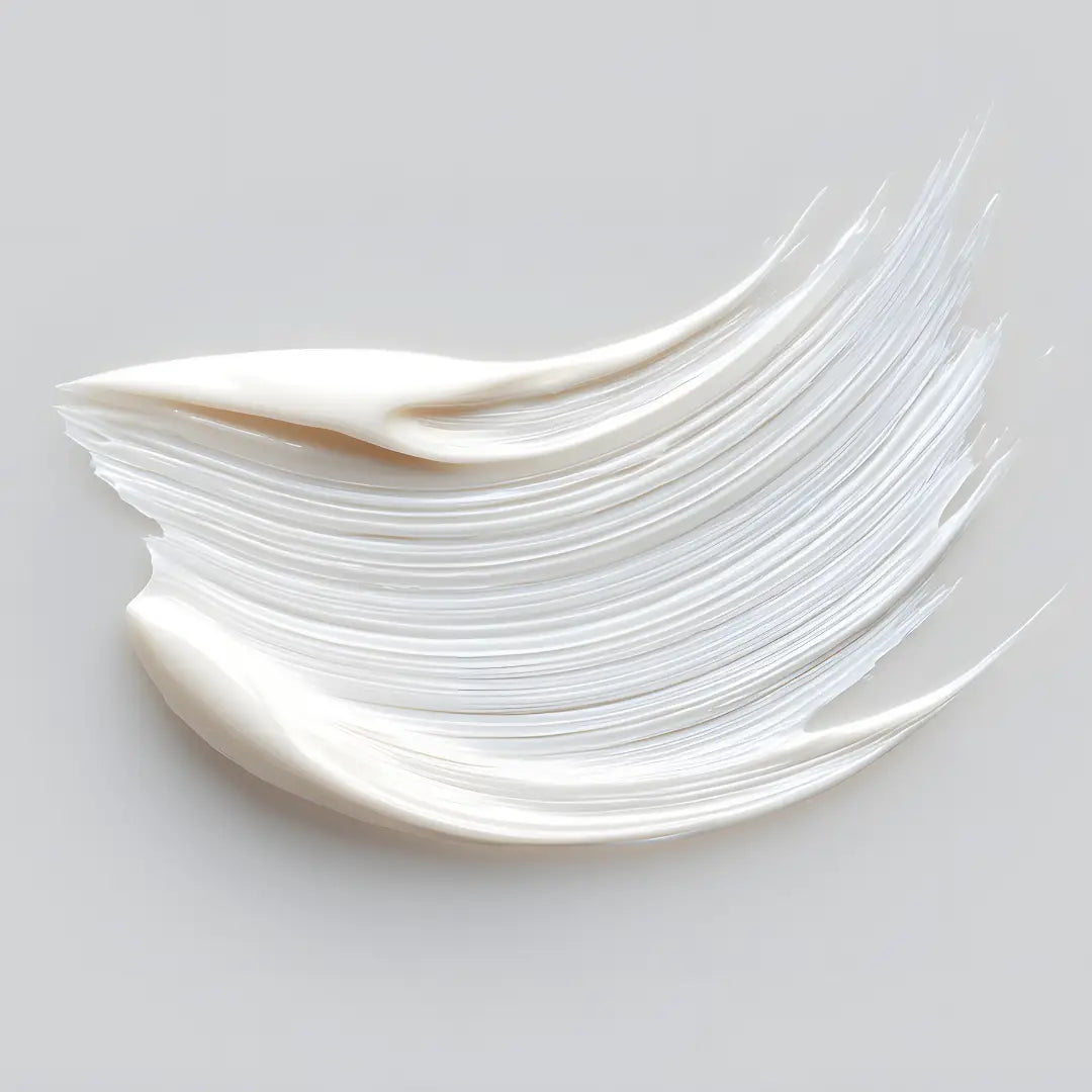 By Valenti white face lotion smear on a light gray background