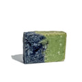 By Valenti two-tone green and blue Pineta Barcola French clay bar soap on a white background