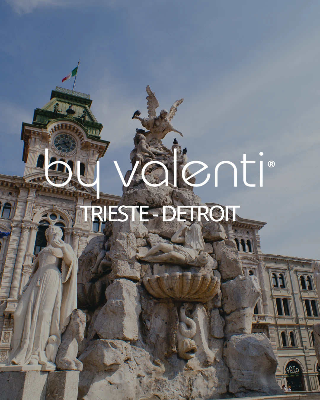 Famous Trieste, Italy landmark with statues and architectural elements, featuring 'by valenti' branding.