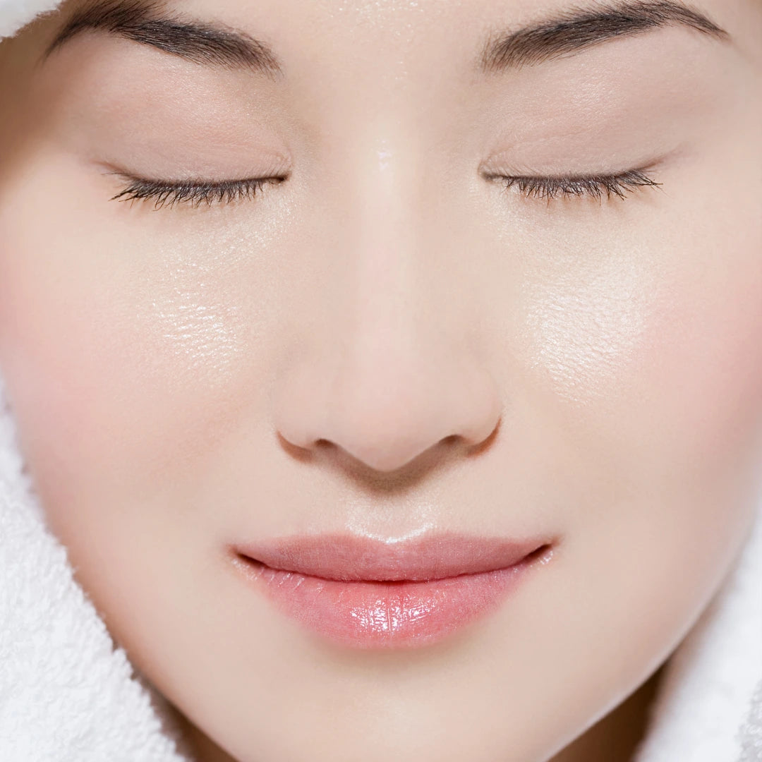 Close up of an Asian woman's face with porcelain white skin